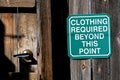 Clothing required beyond this point sign.