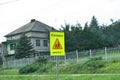 a sign on the side of the road expressing caution due to school ahead,
