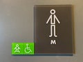 A sign signifying a mens bathroom or lavatory entrance