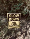 sign.. SLOW DOWN THIS IS NOT A RACETRACK Royalty Free Stock Photo