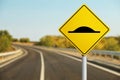 Sign Speed Bump near asphalt road outdoors Royalty Free Stock Photo