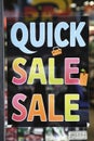 A sign in a store window advertising quick sale and clearance, AI Royalty Free Stock Photo