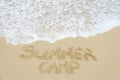 Sign Summer Camp on the sandy beach Royalty Free Stock Photo