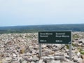 The sign at the summit of Gros Morne Mountain when hikers reach the summit.