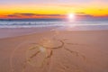 Sign of the sun on sand the beach by the sea Summer vacation concept with Foam wave crashing on sandy shore Amazing island seaside Royalty Free Stock Photo