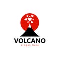 Sign or symbol of a black volcano with erupting hearts against a red sun.