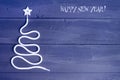 Sign symbol Christmas tree on a wooden background. A copy of space. The idea of a merry new year. Christmas. Royalty Free Stock Photo