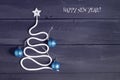 Sign symbol Christmas tree on a wooden background. A copy of space. The idea of a merry new year. Christmas. Royalty Free Stock Photo