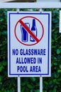 Sign that tells people that glassware is not allowed in the swimming pool area Royalty Free Stock Photo