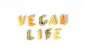 Sign, text vegan life made of italian pasta on white background, veggie diet and eating concept