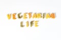 Sign, text vegetarian life made of italian pasta on white background, veggie diet and eating concept