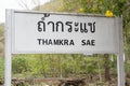 Sign of Thamkra Sae Bridge train station in Kanchanaburi in Thailand