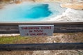 Sign - Throwing coins in pool is unlawful at the Fountain Paint Pots area of Yellowstone National Park Royalty Free Stock Photo