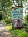Sign to the Otter Sanctuary and Butterfly Farm near the South Devon Railway tourist attraction, Buckfastleigh, Devon, UK