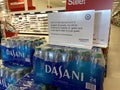 Eau Claire, Wisconsin - March 30, 2020: Sign on top of a stack of Dasani bottled water reminds customers that quantities are limit