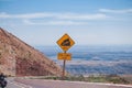Sign of traffic alerts downhill slope. Royalty Free Stock Photo