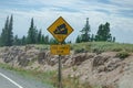 Sign of traffic alerts downhill slope.