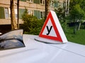 Sign training vehicle. Car with a driving school sign on the roof. Driving school concept, driving license, traffic