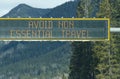 Sign on Trans-Canada Highway `Avoid non-essential travel` Royalty Free Stock Photo