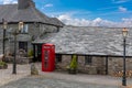 A classic British red telephone box stands out the Jamaica Inn in Cornwall