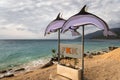 Sign with two dolphins showing the beginning of the nudist beach Royalty Free Stock Photo