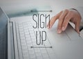 Sign up text against hand on laptop Royalty Free Stock Photo