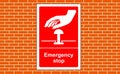 Emergency stop button sign right on a wall