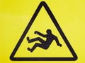 The sign is a very slippery floor. Slip on the floor. yellow Royalty Free Stock Photo