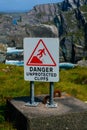 A sign warning of the dangerous cliffs at Mizen Head, Ireland Royalty Free Stock Photo