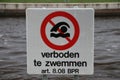 Sign with warning that swimming is not allowed in the water in the dutch language `Verboden te zwemmen Royalty Free Stock Photo