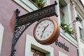 A sign `Watch and clock repairs` in the historical part of the city Alt Markt.