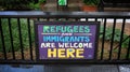 Sign welcoming immigrants and refugees