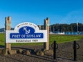 A sign welcoming visitors to the Port of Siuslaw in Florence, Oregon, USA - November 20, 2021
