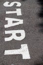 Sign white start on road Royalty Free Stock Photo