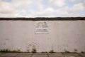 Sign on a white wall requesting minimum noise and no skateboarding or ball games Royalty Free Stock Photo