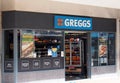 Sign and window display on the greggs bakers shop on bond street in leeds city centre