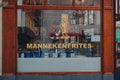 Sign at the window of Manneken Frites restaurant in Brussels, Belgium