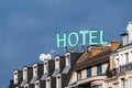 Sign with the word \'HOTEL\' on the top of a building in Paris, France Royalty Free Stock Photo