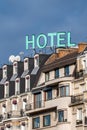 Sign with the word \'HOTEL\' on the top of a building in Paris, France Royalty Free Stock Photo