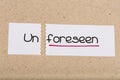 Sign with word unforeseen turned into foreseen Royalty Free Stock Photo