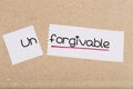 Sign with word unforgivable turned into forgivable