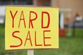 Sign Yard sale written on yellow paper outdoors, closeup Royalty Free Stock Photo