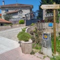 Sign with yellow scallop shell signing the way to Santiago de Compostela on the Saint James pilgrimage way, Camino Portuguese Royalty Free Stock Photo