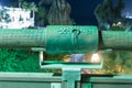 Sign of the zodiac Aquarius on the bridge of the Wishing Bridge in the green light of a spotlight located on old city Yafo in Tel