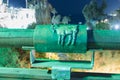 Sign of the zodiac Capricorn on the bridge of the Wishing Bridge in the green light of a spotlight located on old city Yafo in Tel