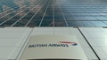 Signage board with British Airways logo. Modern office building facade. Editorial 3D rendering