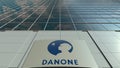 Signage board with Danone logo. Modern office building facade. Editorial 3D rendering Royalty Free Stock Photo