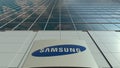 Signage board with Samsung logo. Modern office building facade. Editorial 3D rendering