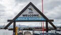 Signage board for whale watching boat tours, town of Husavik, Skjalfandi Bay, Iceland Royalty Free Stock Photo