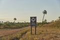 Signage with the drawing of a capybara and the text Slow down. Wildlife crossing